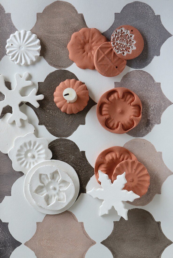 Clay Christmas decorations in white and terracotta on Oriental pattern