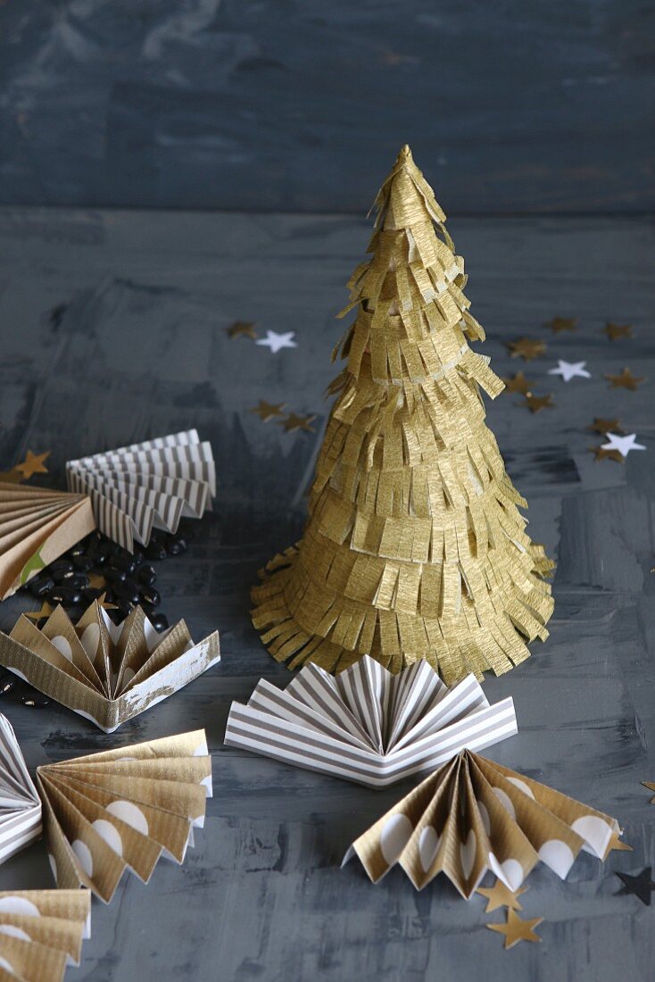 Small hand-made paper Christmas tree and fans