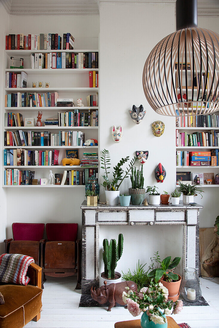 Houseplants on old mantelpiece in living room