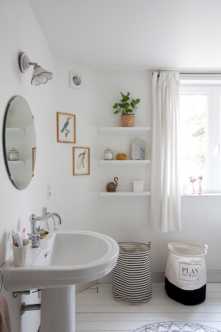 Laundry basket in simple white bathroom