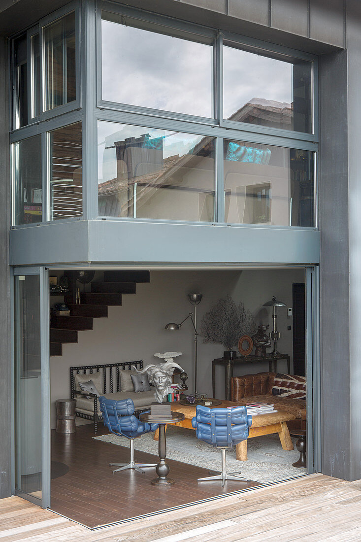 Open sliding doors between living room and terrace