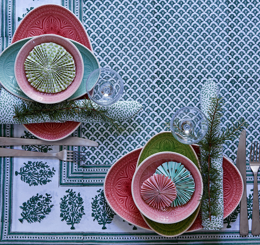 Patterned plates decorated with rosettes on set table