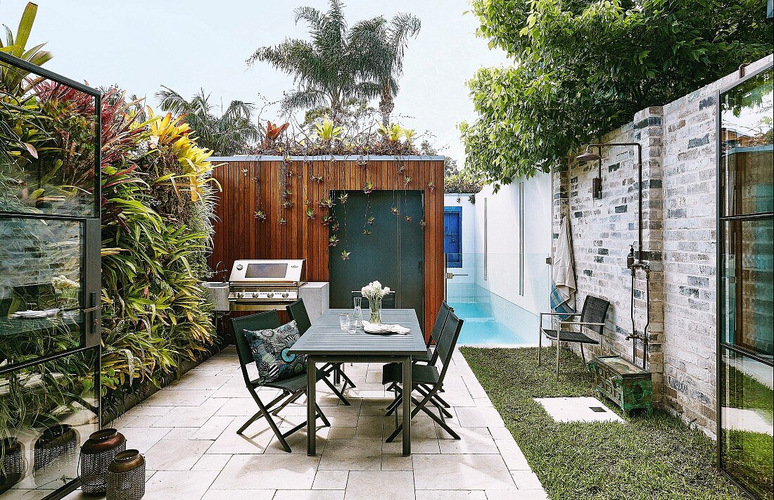 Terrace with vertical planting, pool and seating area