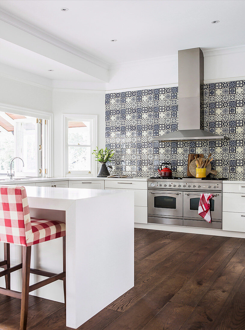 Large modern country kitchen with blue patterned tiles