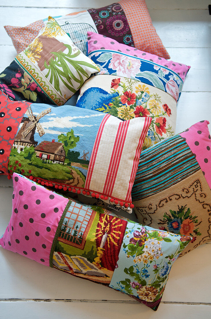 Homemade patchwork cushions made from patterned fabrics and tapestries