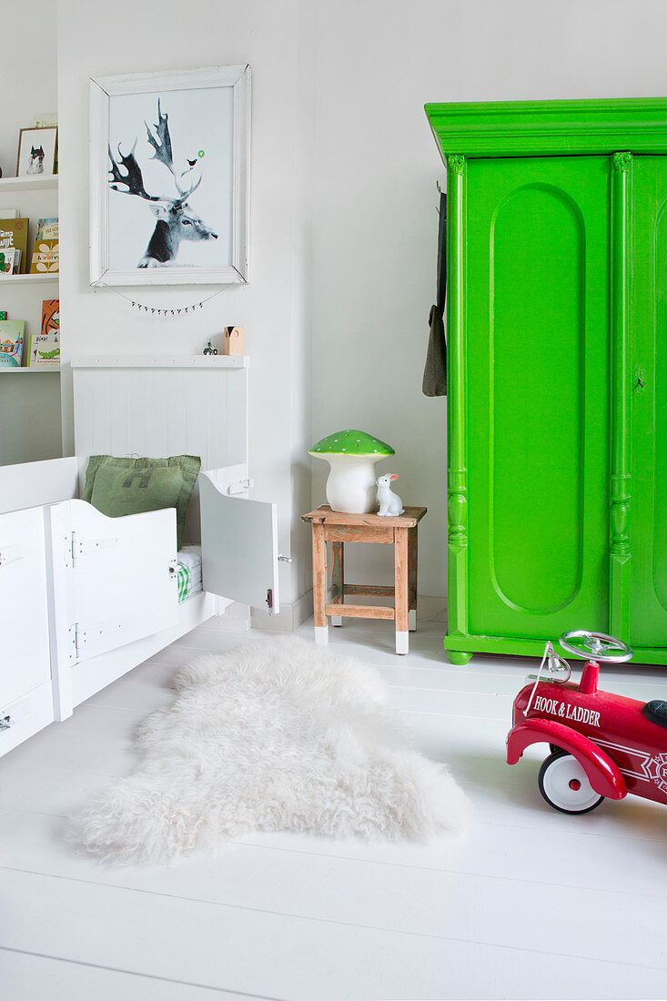 Neon-green wardrobe in white child's bedroom