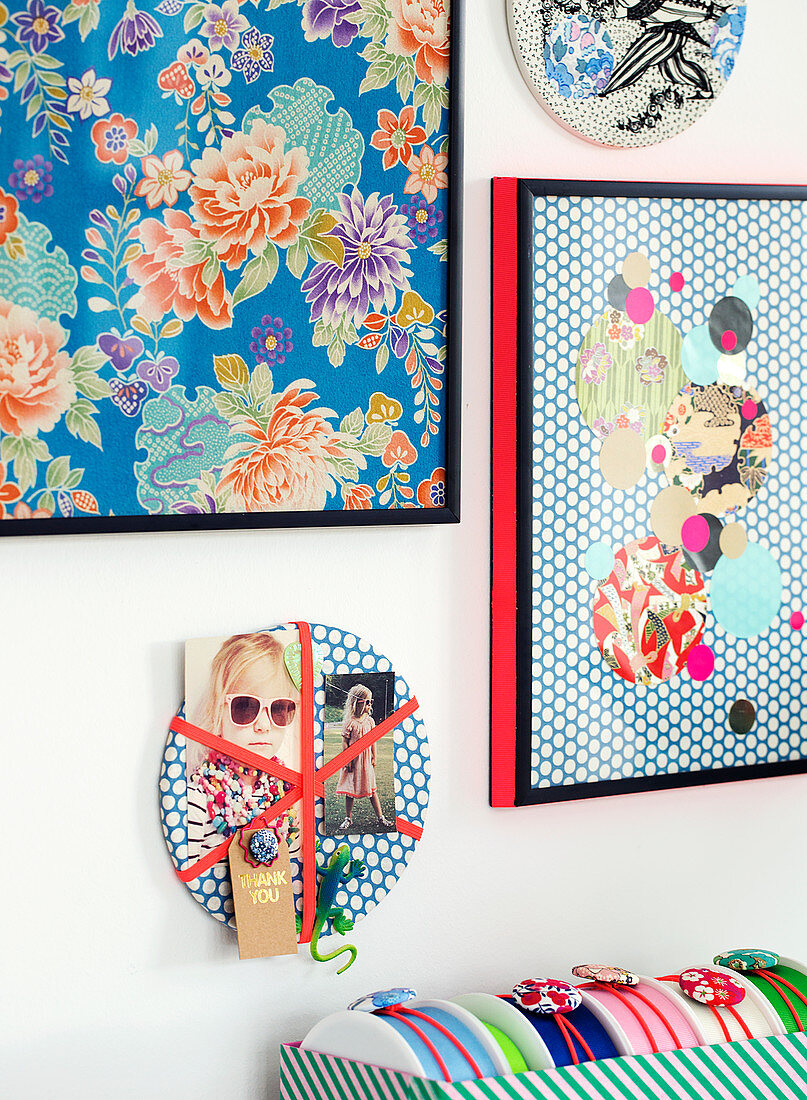 Pictures, collages and a small pin board made of patterned paper
