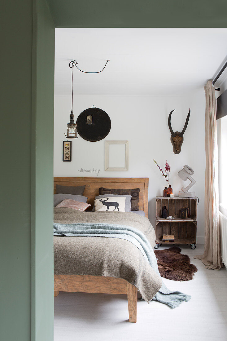Glance into a rustic bedroom in earth tones