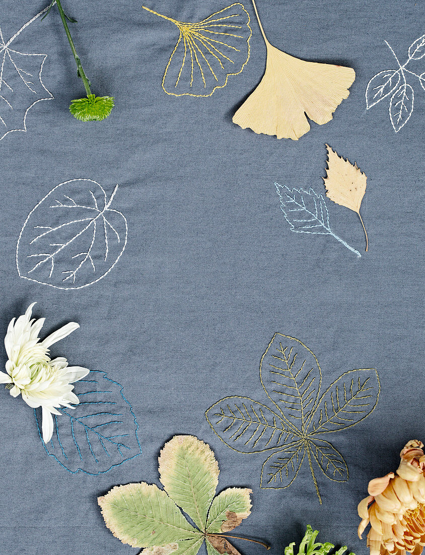 Embroidered cloth with autumn leaves