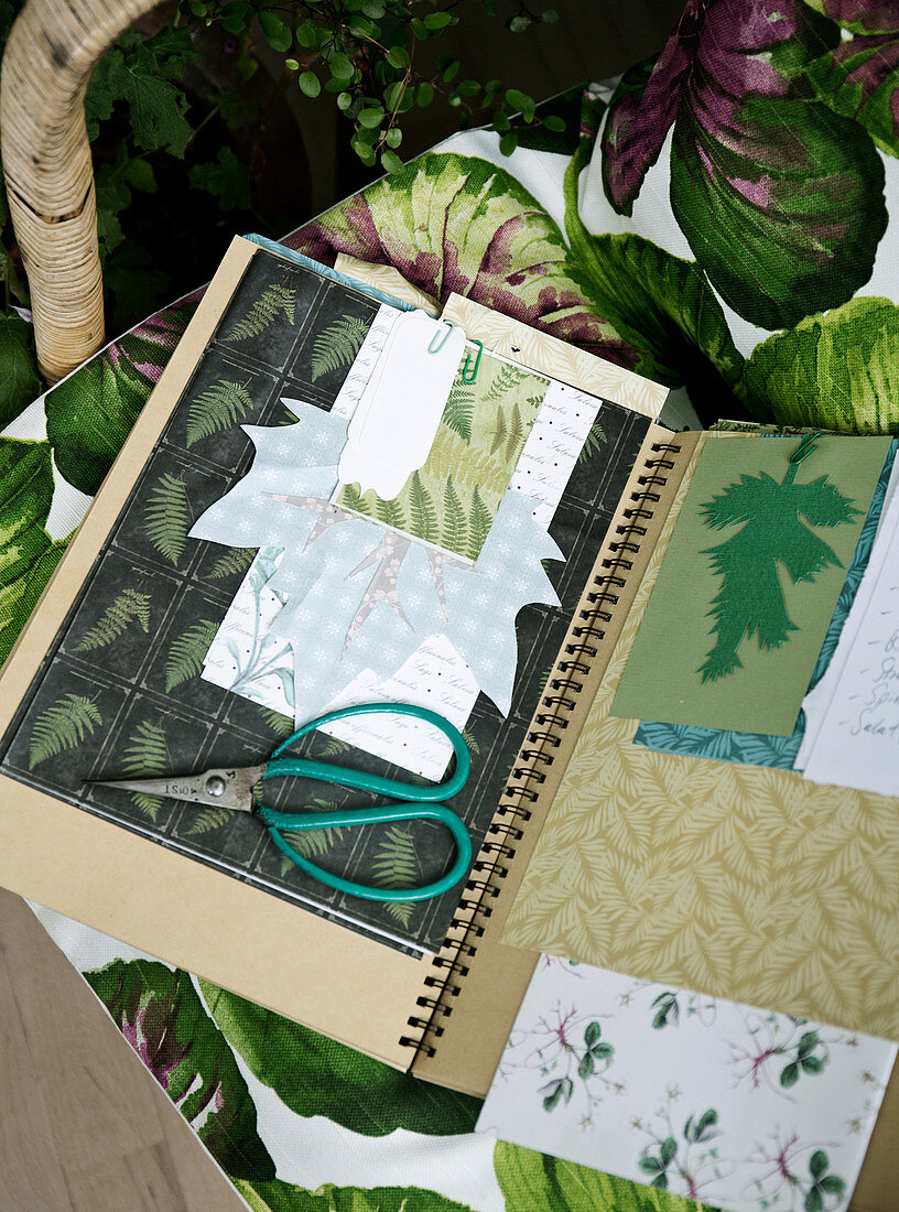 Collage with botanical motifs in a notebook