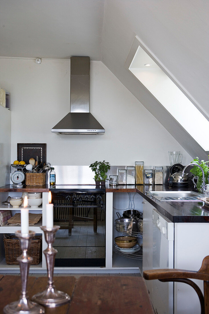 Modern kitchen under the eave with skylight
