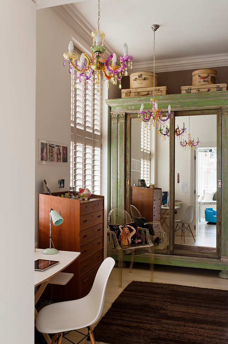 Old cupboard with mirrored doors in vintage-style teenager's bedroom