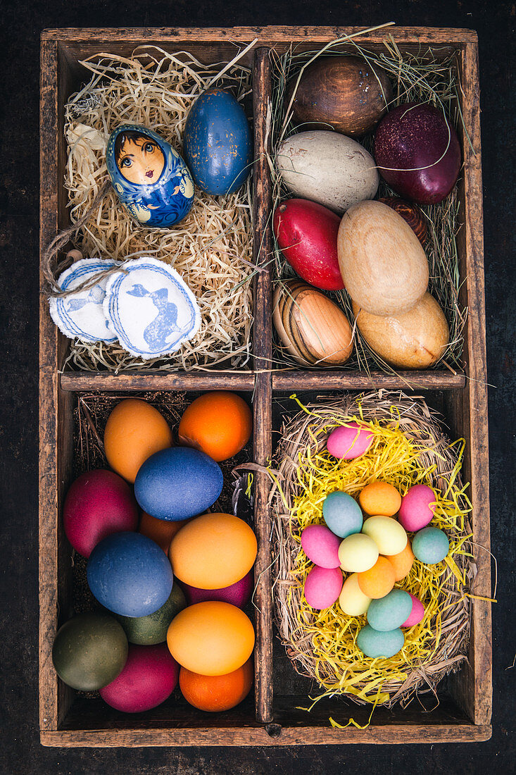 Easter eggs coloured with organic dyes in a seedling tray