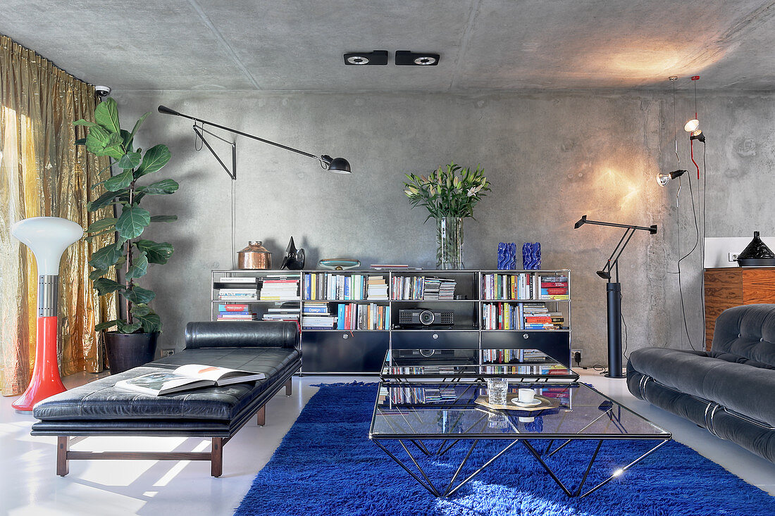 Living room in masculine designer style with concrete ceiling
