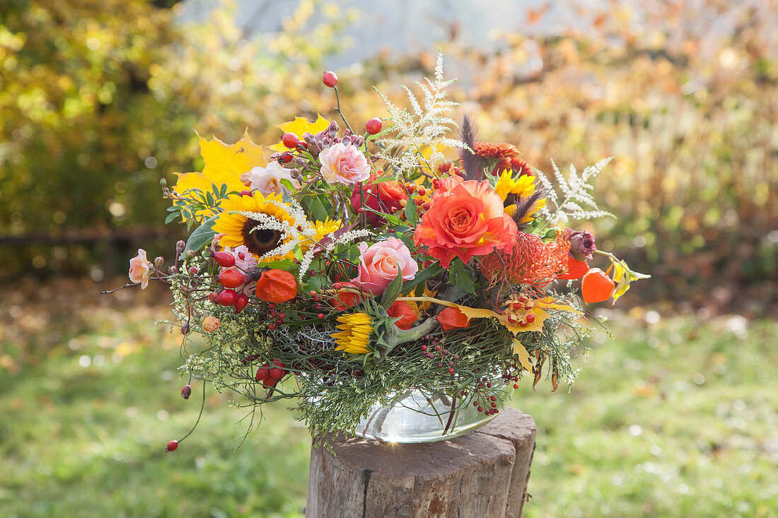 Autumn bouquet in glass bowl