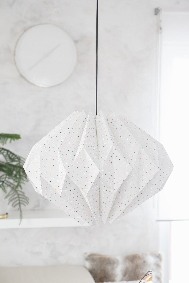 Handmade lamp made from folded wallpaper