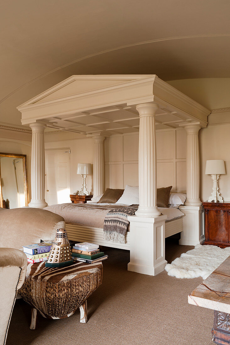 Oak painted off-white four poster bed resembling a classical temple