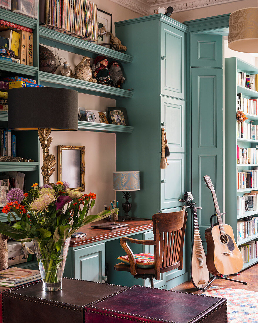 Turquoise fitted cupboards in classic living room