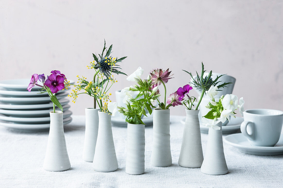 Edible flowers in vases as table decorations