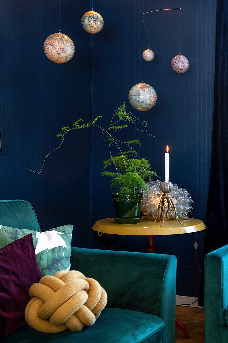 Teal armchairs in interior with blue walls