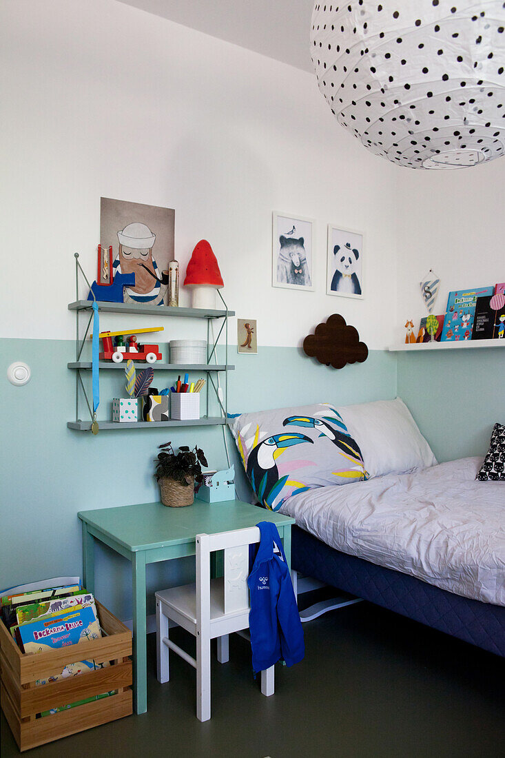 Two-tone walls in boy's bedroom in shades of blue