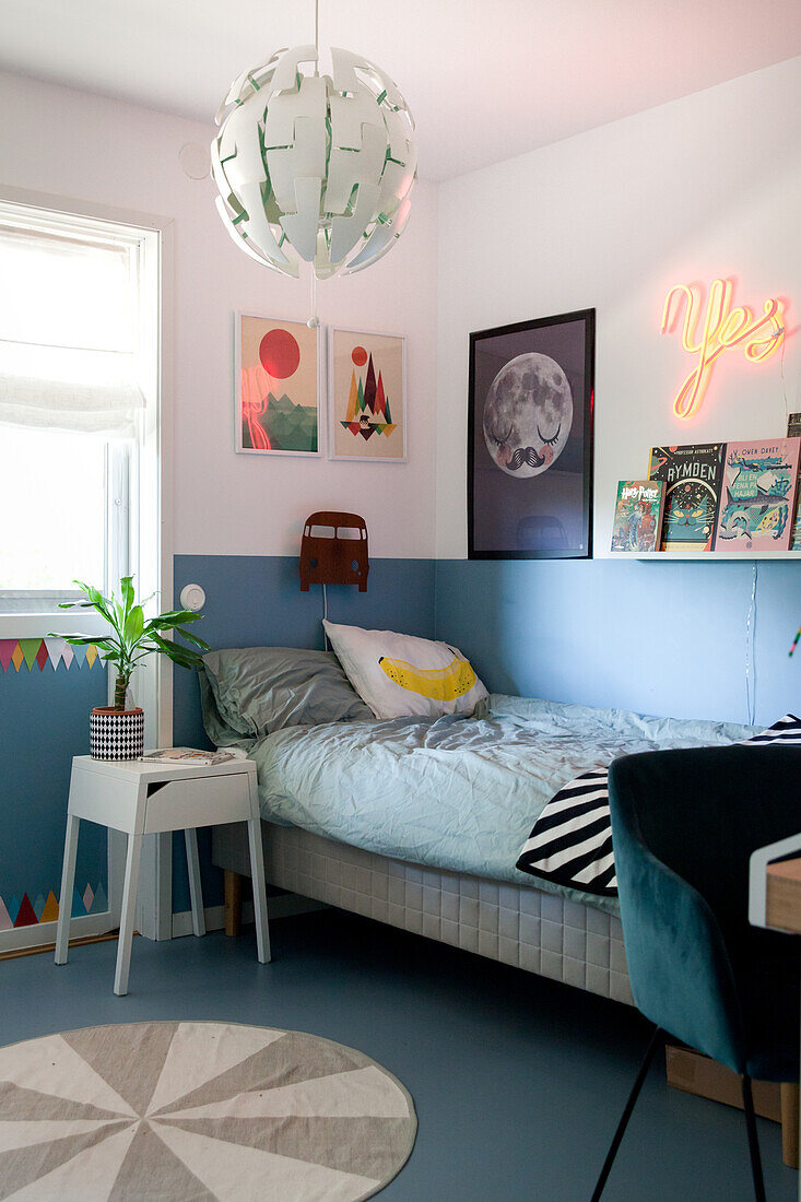 Two-tone walls and blue floor in boy's bedroom