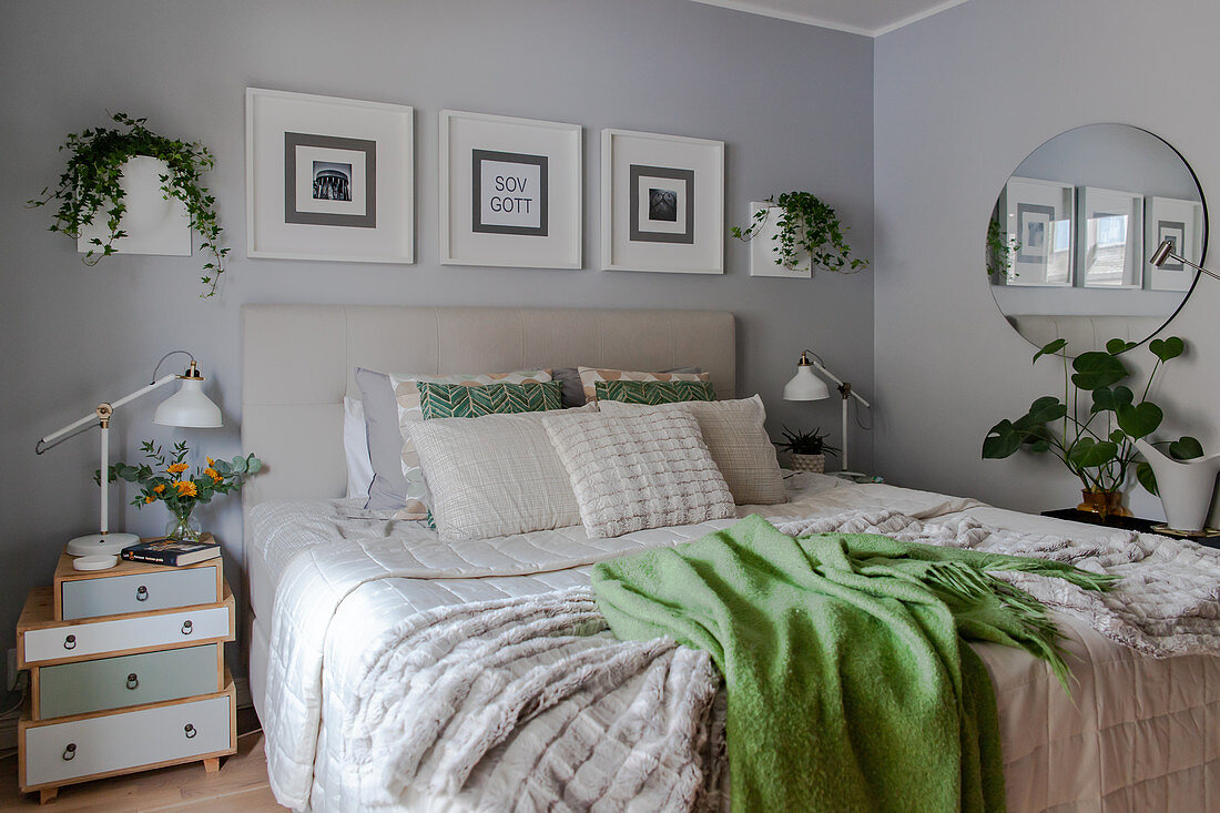Scandinavian-style bedroom decorated in grey, white and green