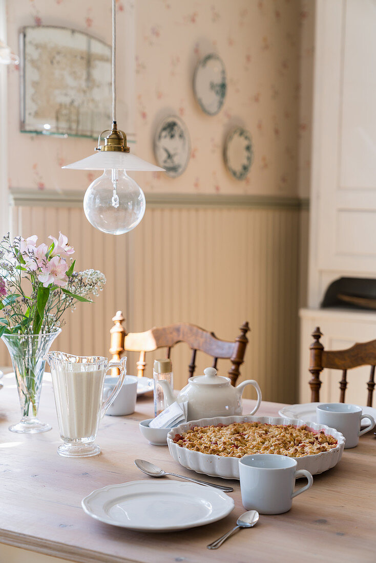 Cake on set table in country-house-style dining room
