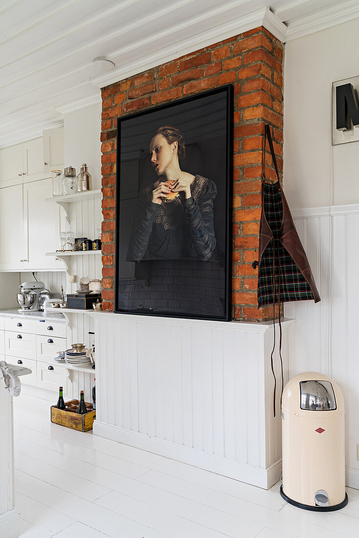 Painting on brick wall in kitchen