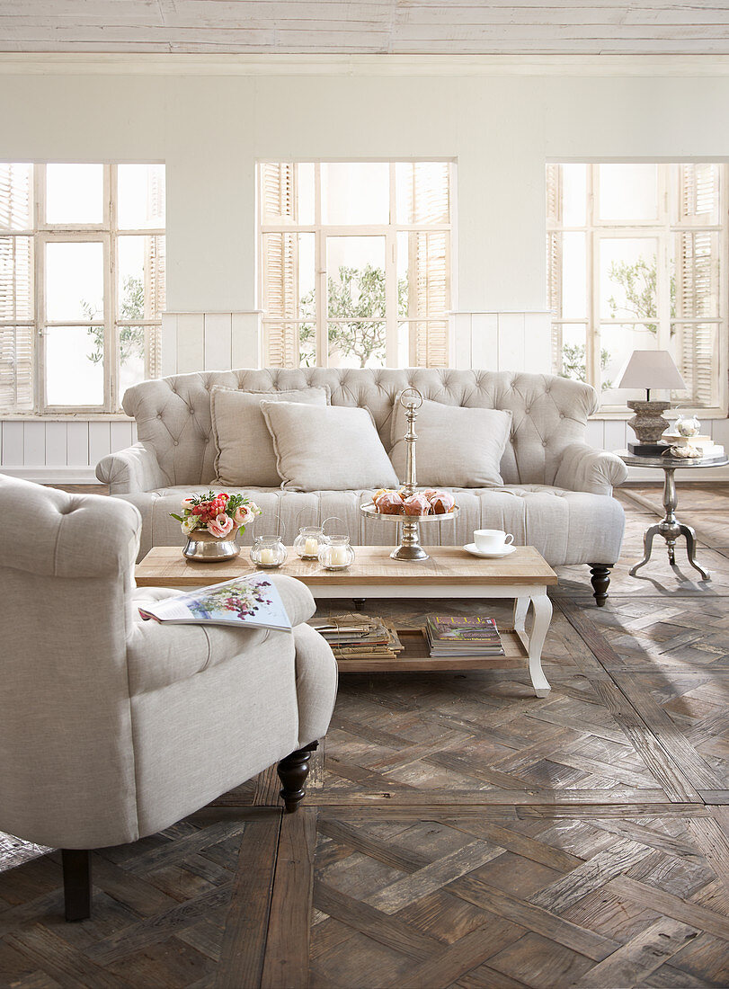 Cream Chesterfield furniture in elegant living room