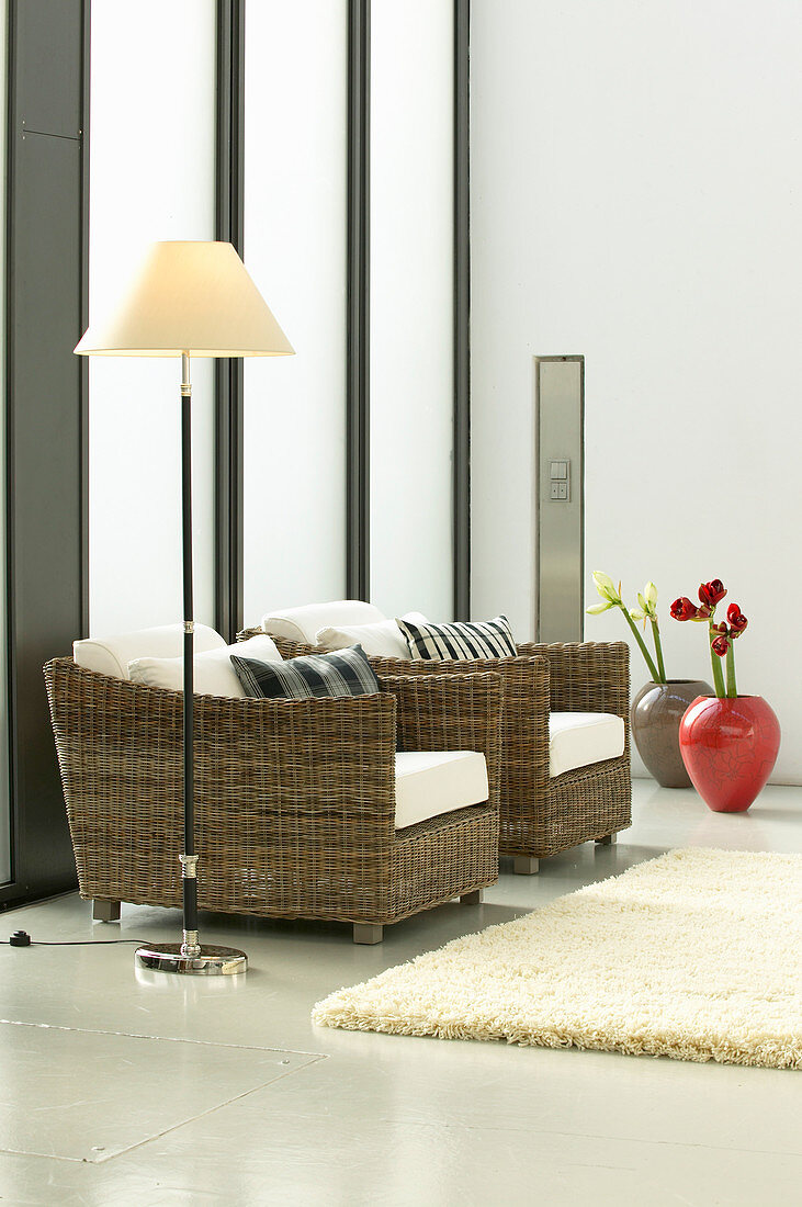 Wicker armchairs in elegant, modern living room