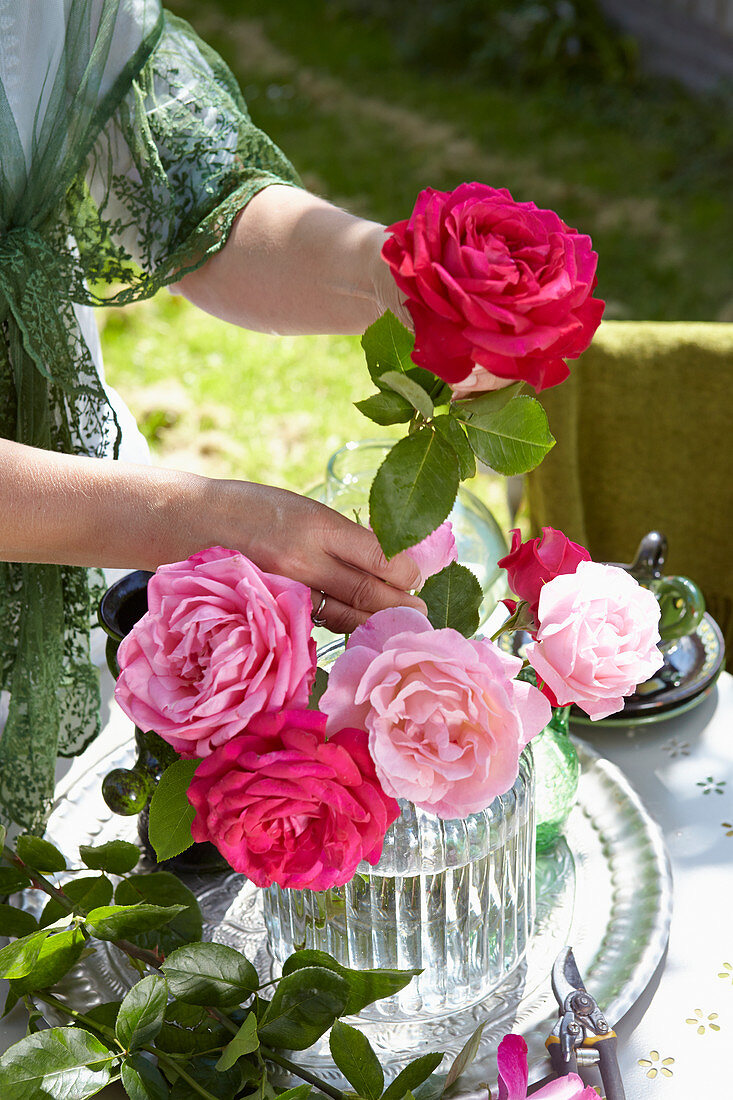 Woman arranging roses
