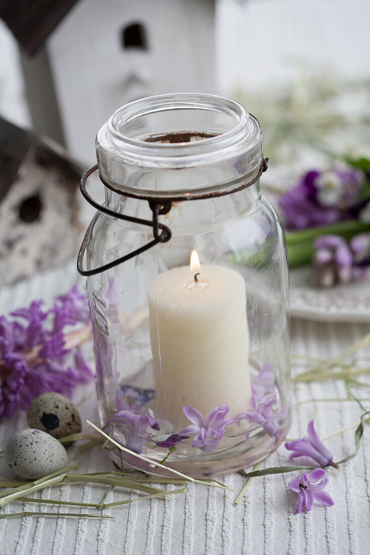 Candle in mason jar, hyacinths and quail eggs