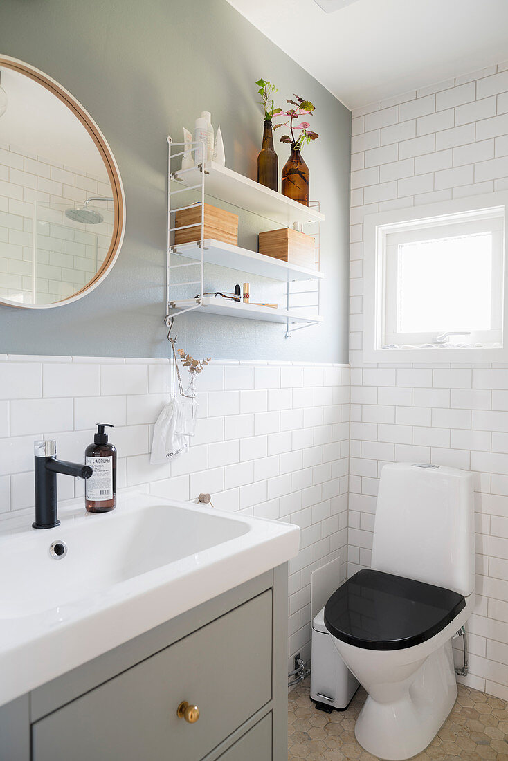 Small, classic bathroom in white and grey with subway tiles