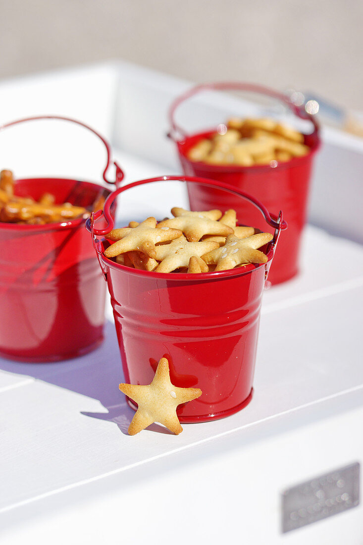 Star-shaped snacks in miniature red buckets