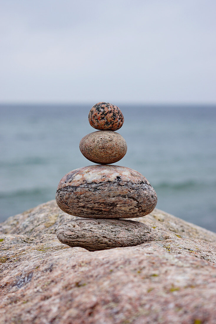 Stacked pebbles on sea shore