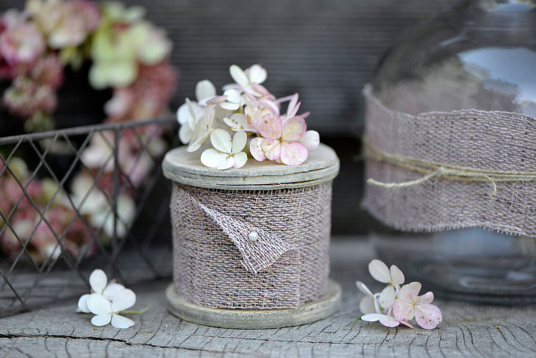 Reel of hessian ribbon decorated with hydrangea florets