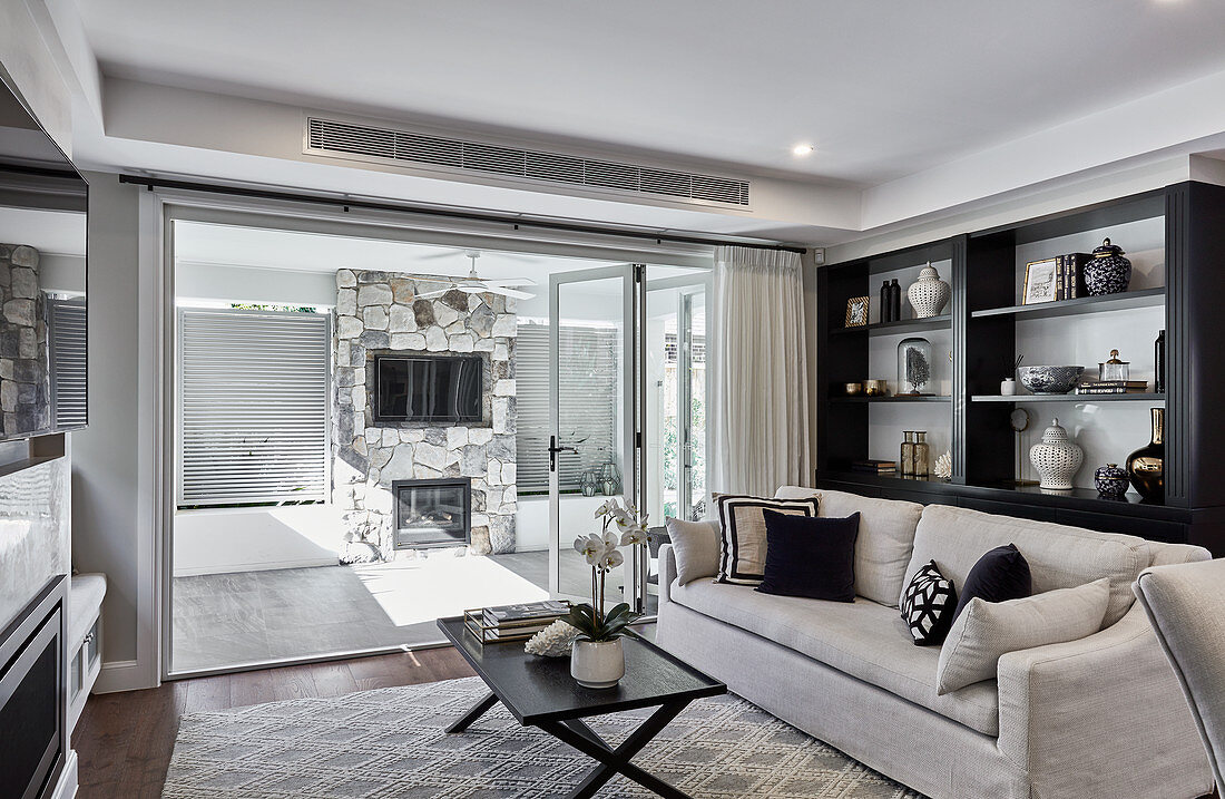 Elegant lounge with open terrace doors