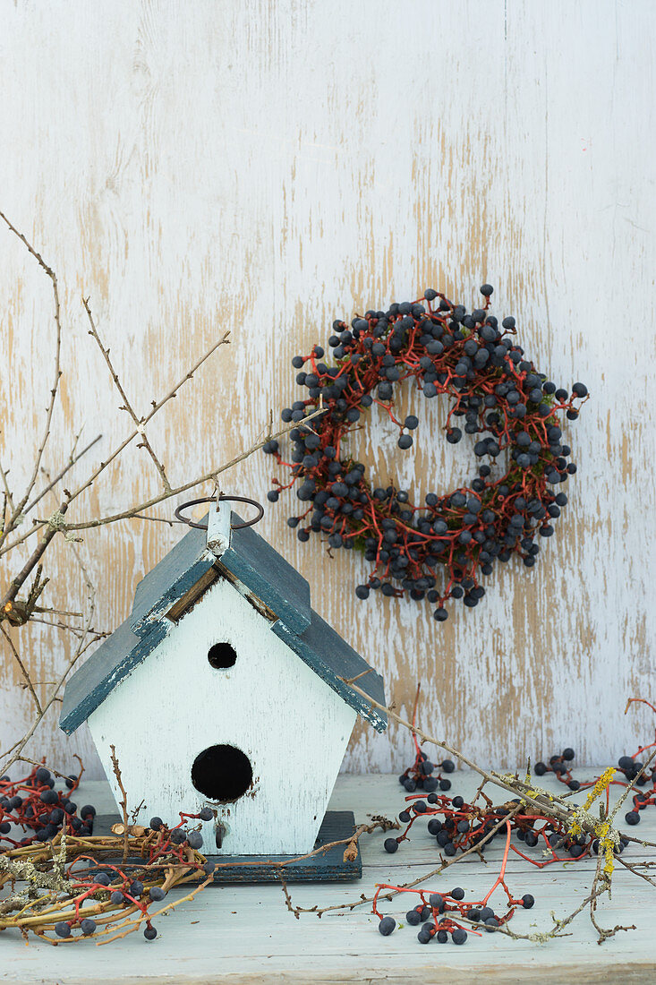 Bird nesting box with wreath of Virginia creeper berries