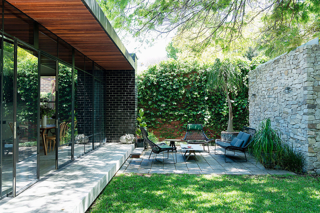 Terrace area and lawn in a courtyard-like garden