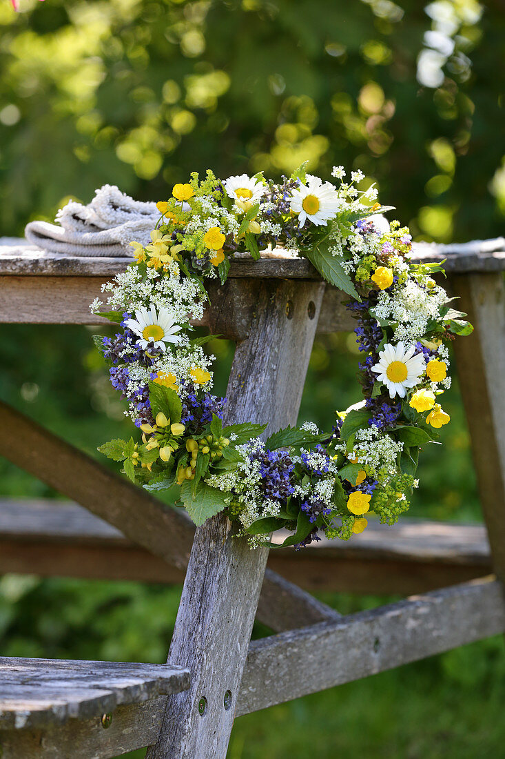 Pretty wildflower wreath with ox-eye daisies, buttercups and ground elder