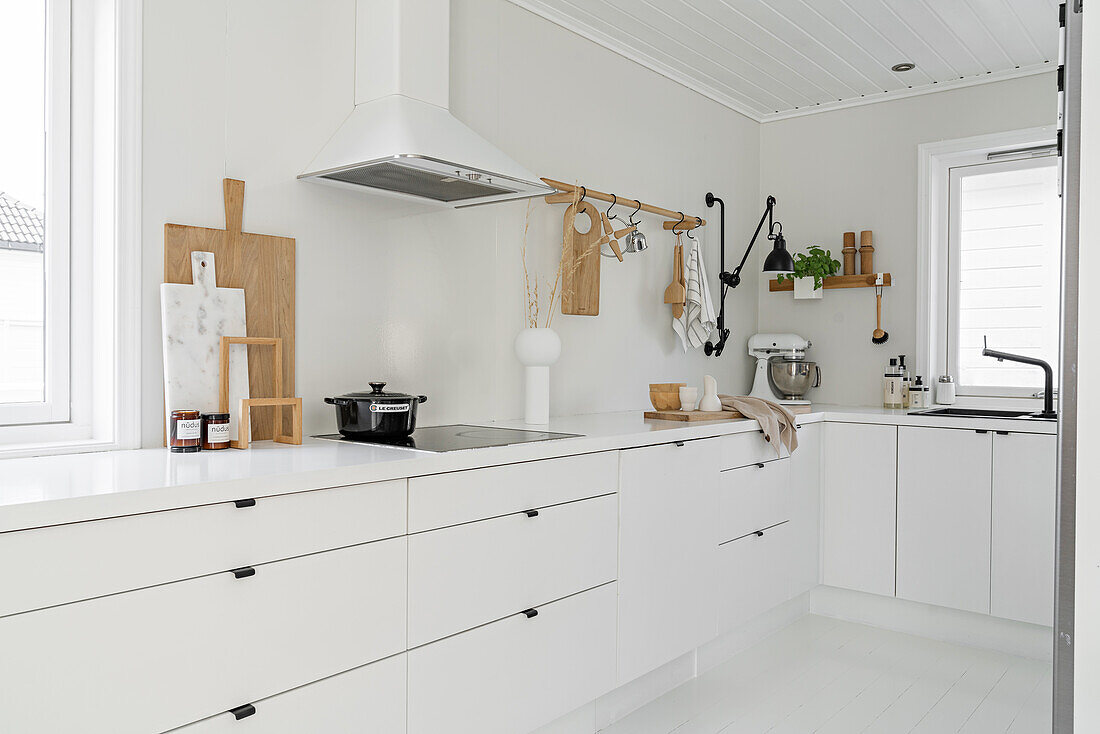 White kitchen in Nordic style with wooden elements