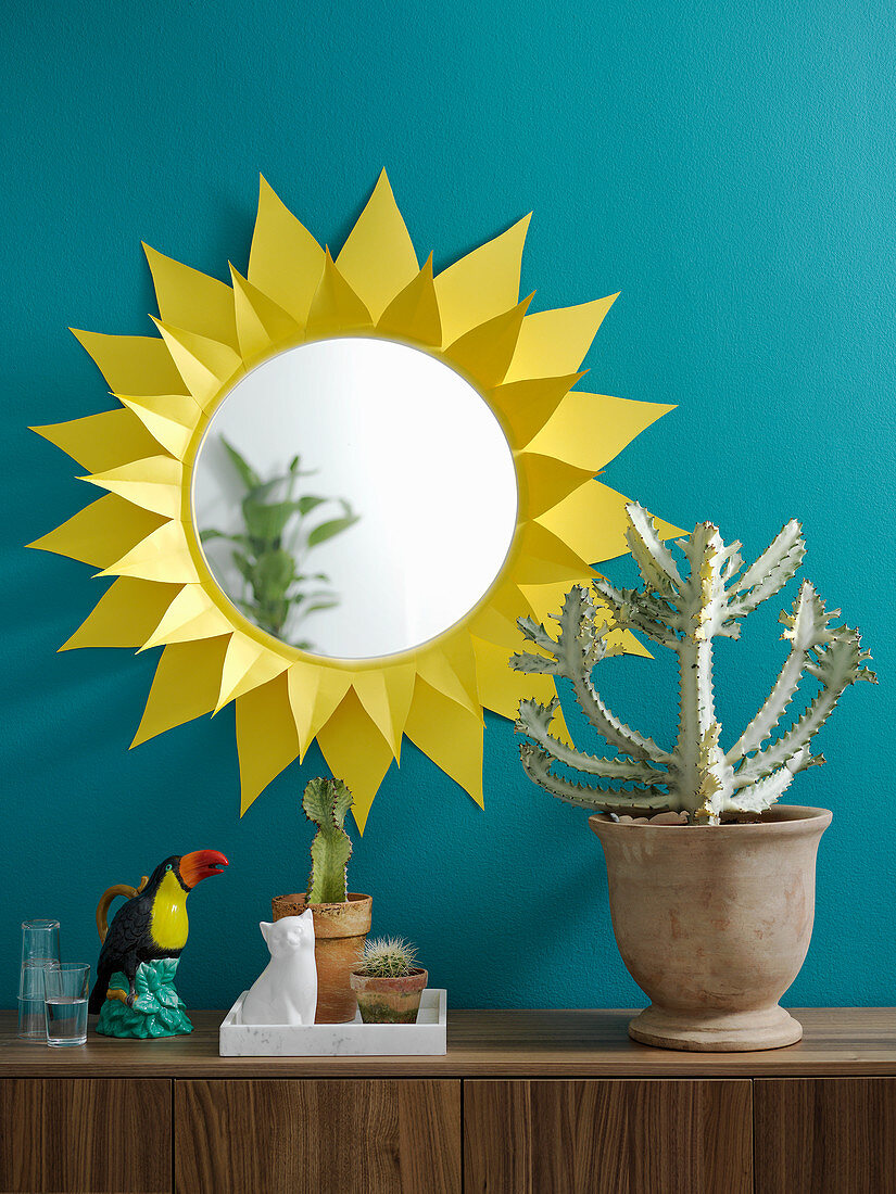Round mirror with handmade yellow paper sunburst