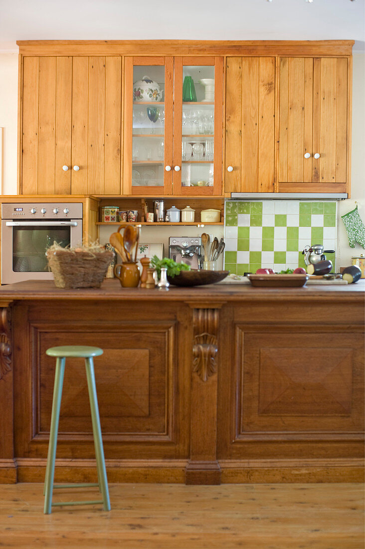 Wooden wall units and counter in country-house kitchen