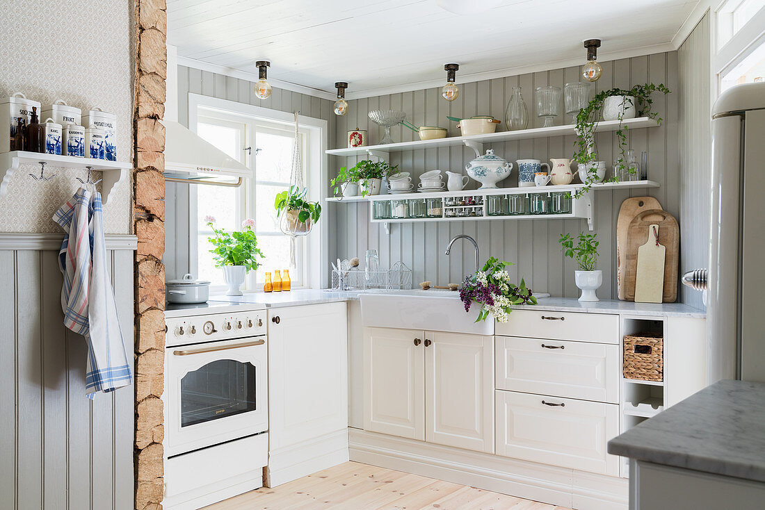 Bright, Scandinavian country-house kitchen in Swedish summer house
