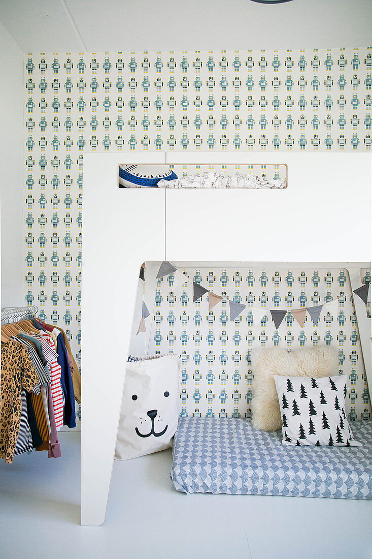 Retro wallpaper and den below loft bed in child's bedroom