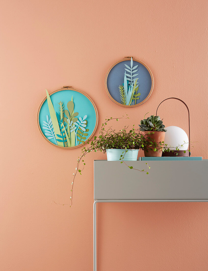 DIY paper flowers in embroidery frames decorating wall