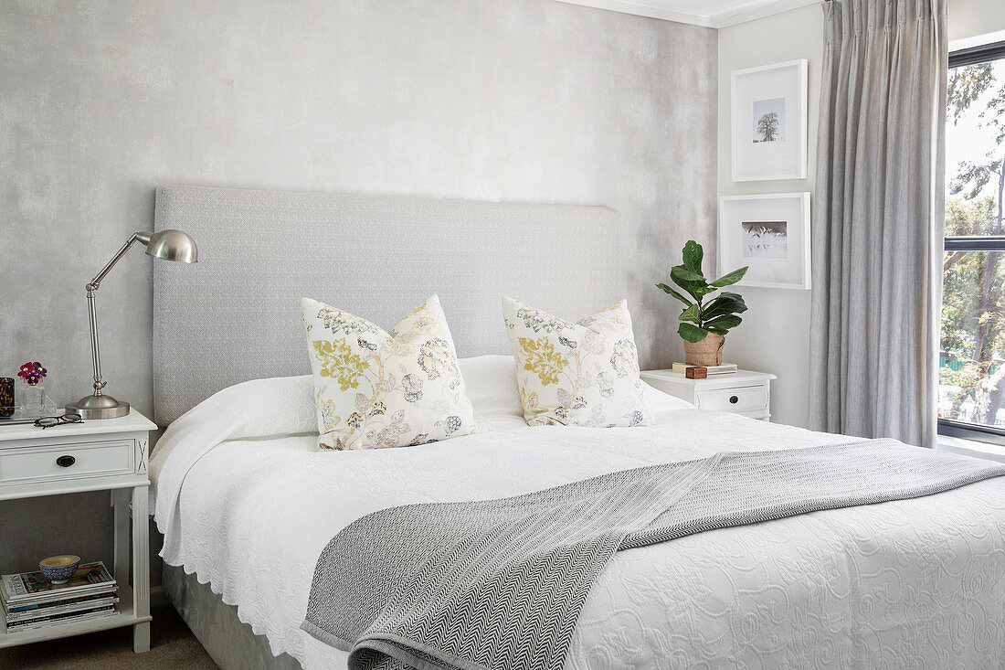 Mottled wall in classic bedroom decorated entirely in grey