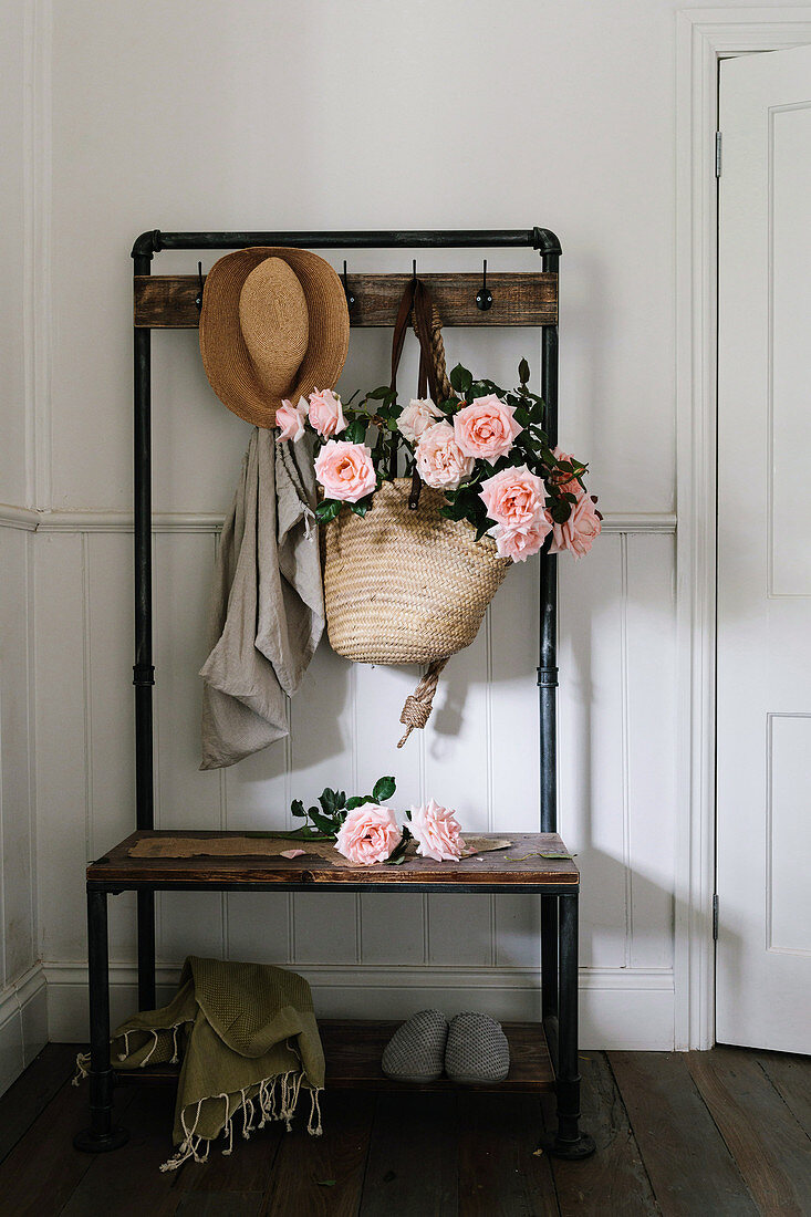 Basket bag with tea roses on vintage wardrobe