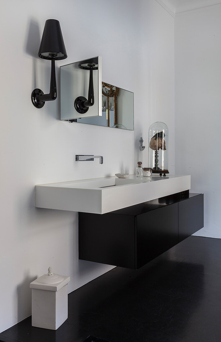 Angular, modern sink with black, floating base unit